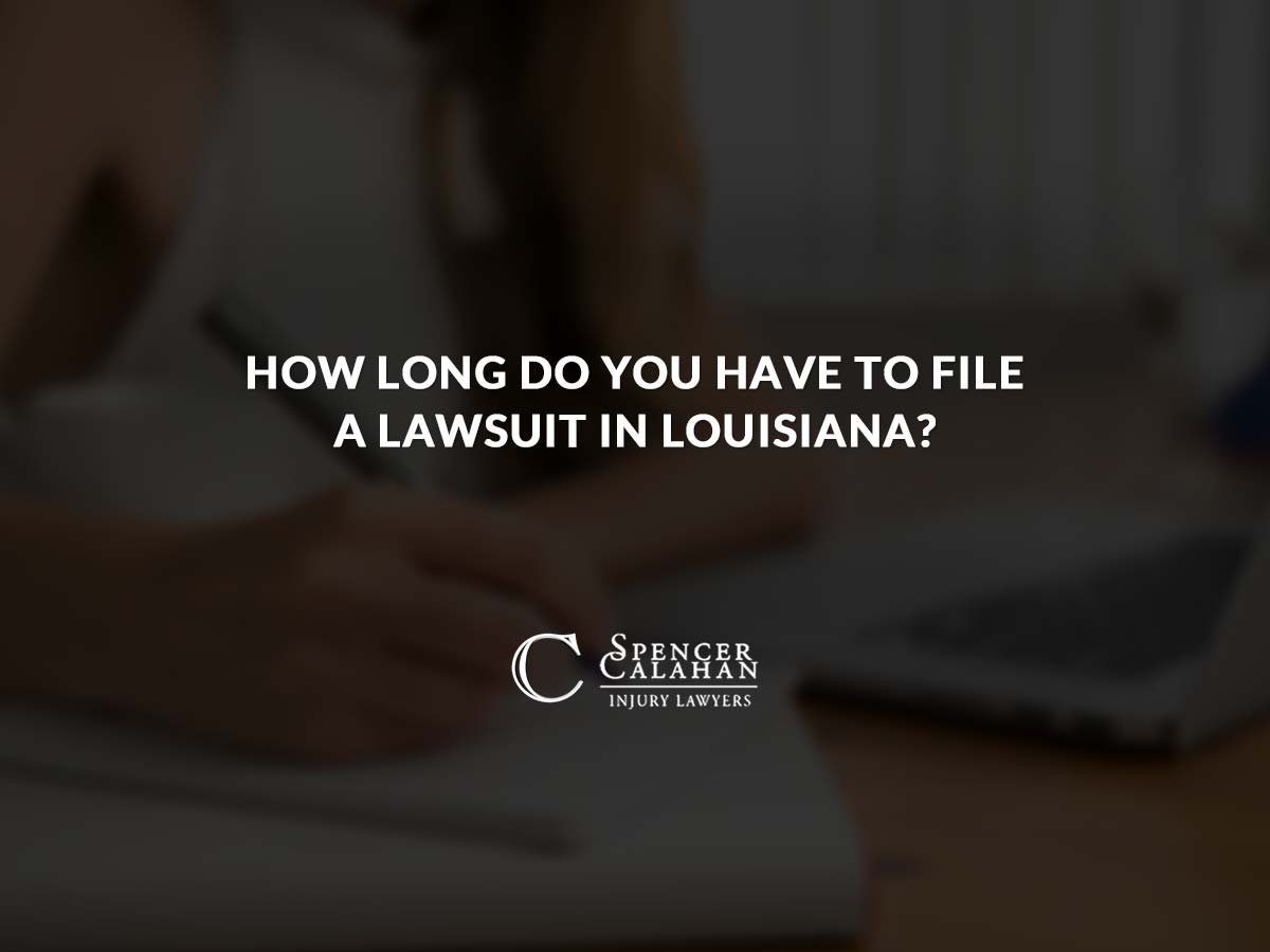 Person at computer doing paperwork. Text overlay: How Long Do You Have to File a Lawsuit in Louisiana?