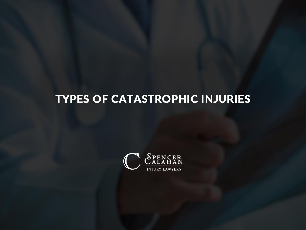Doctor looking at x-rays. Text overlay: Types of Catastrophic Injuries
