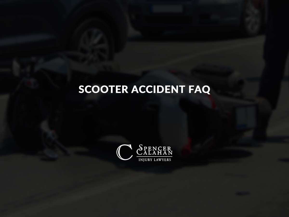 Scooter lying on road side after accident. Text overlay: Scooter Accident FAQ