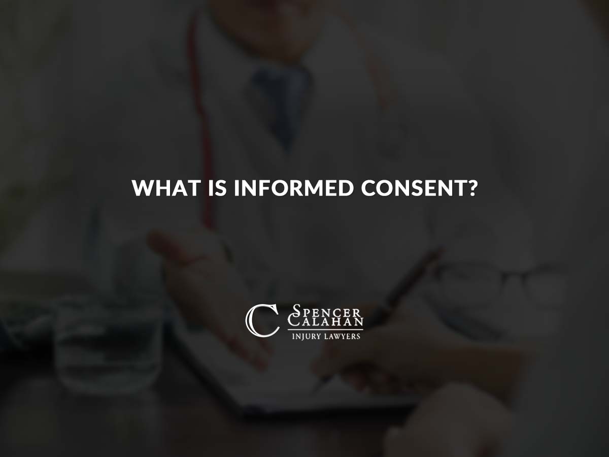 Patient signing form with doctor. Text overlay: What Is Informed Consent?