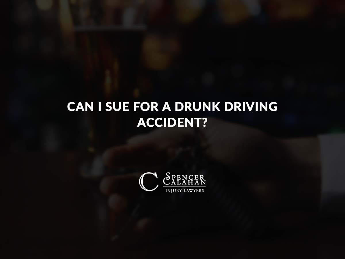 Hand holding keys next to a glass of beer at a bar. Text overlay: Can I Sue for a Drunk Driving Accident?